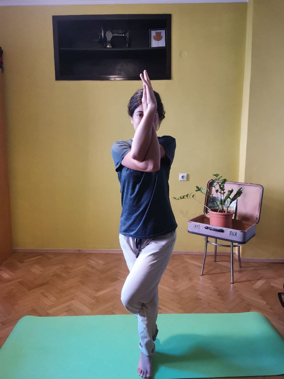 Yoga practice lifting arms up indoors
